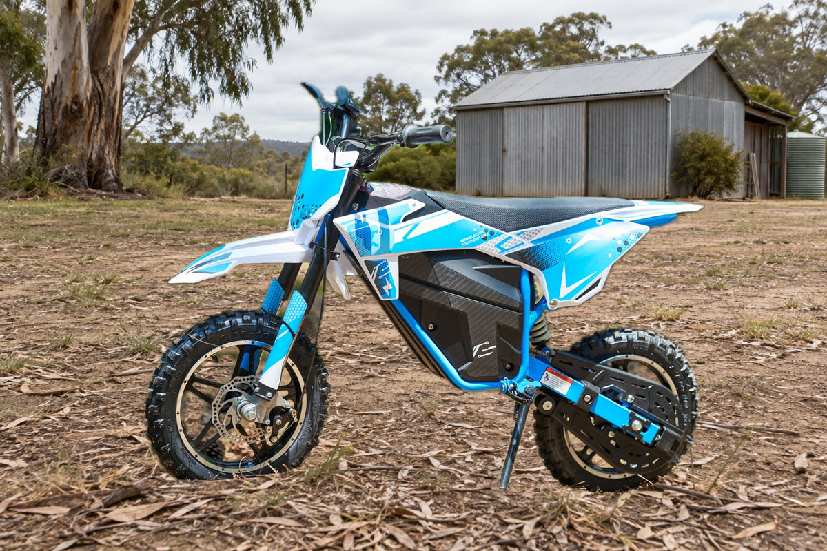Illustrative campaign image of a blue and white Outrider bike beside a shed.