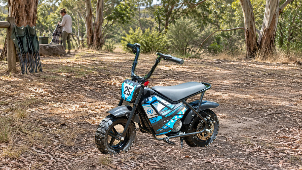 Illustrative campaign image of a blue Joey bike in a woodland setting.